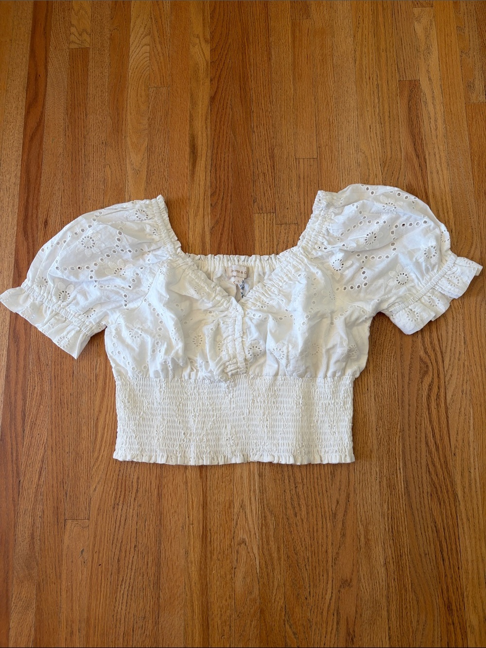 White Eyelet Smocked Puff Sleeve Crop Top by Jennifer & Grace